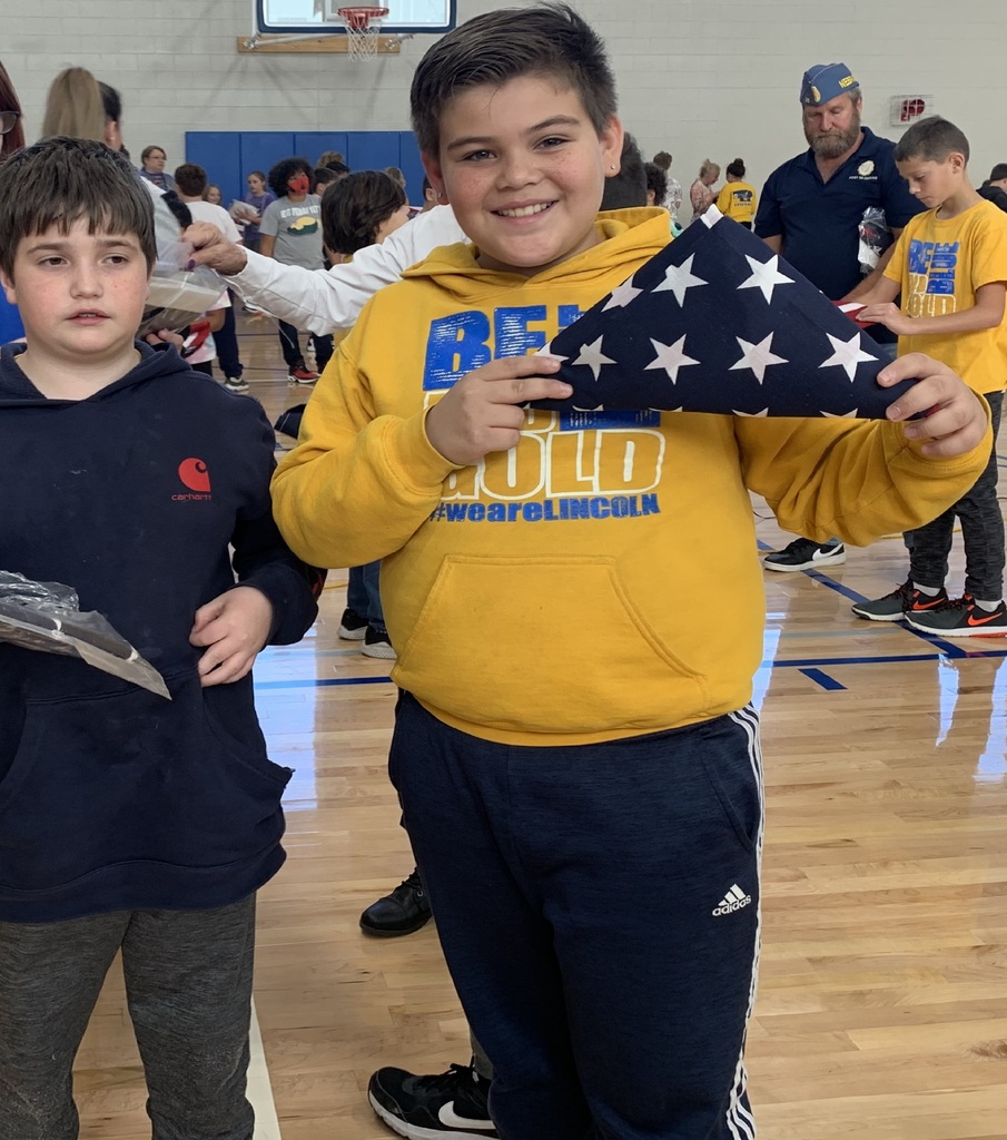 Displaying their properly folded American Flag2
